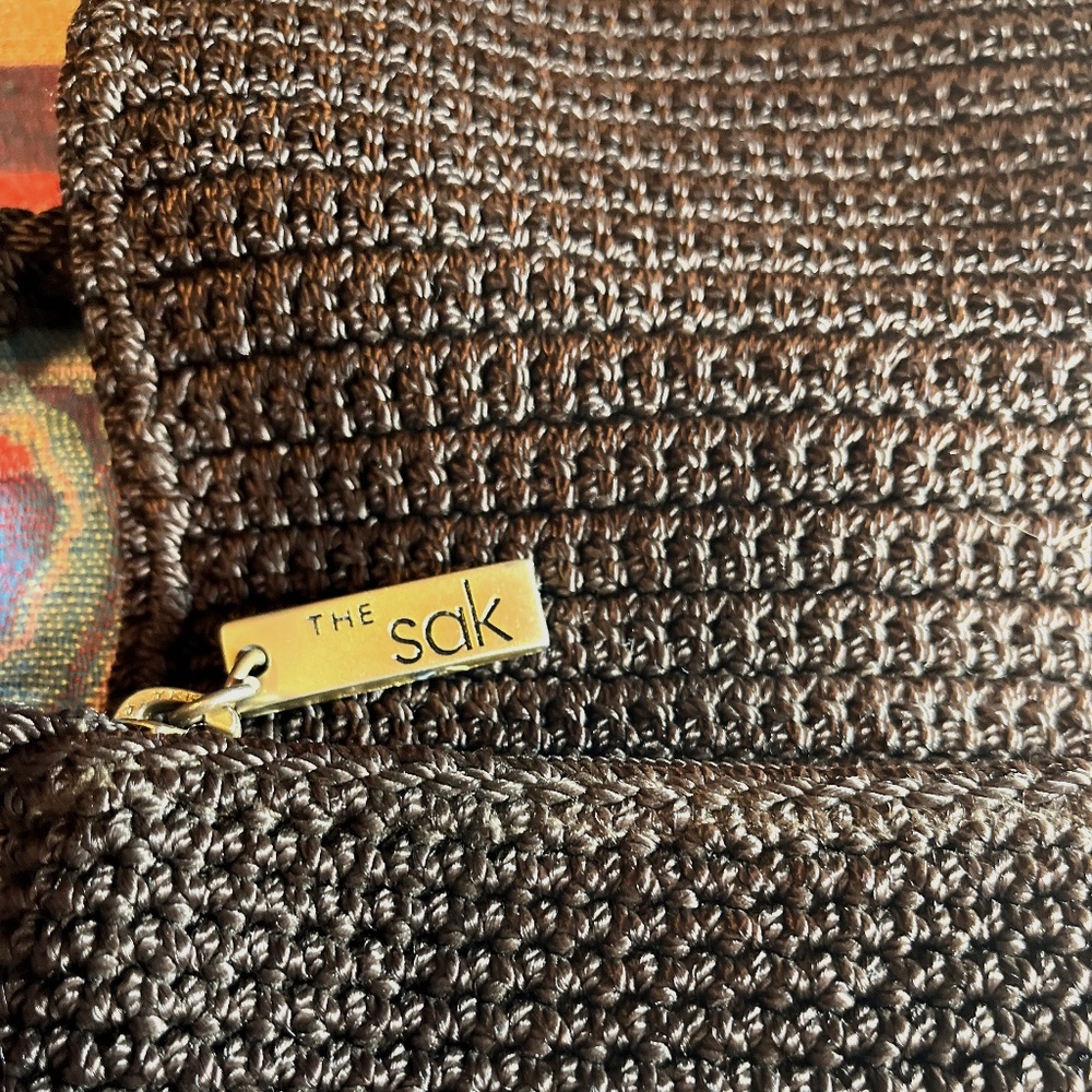 The SAK small brown crochet knit woven crossbody bag with flap over zipper